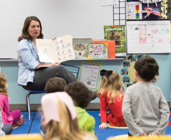 Teacher reading to children